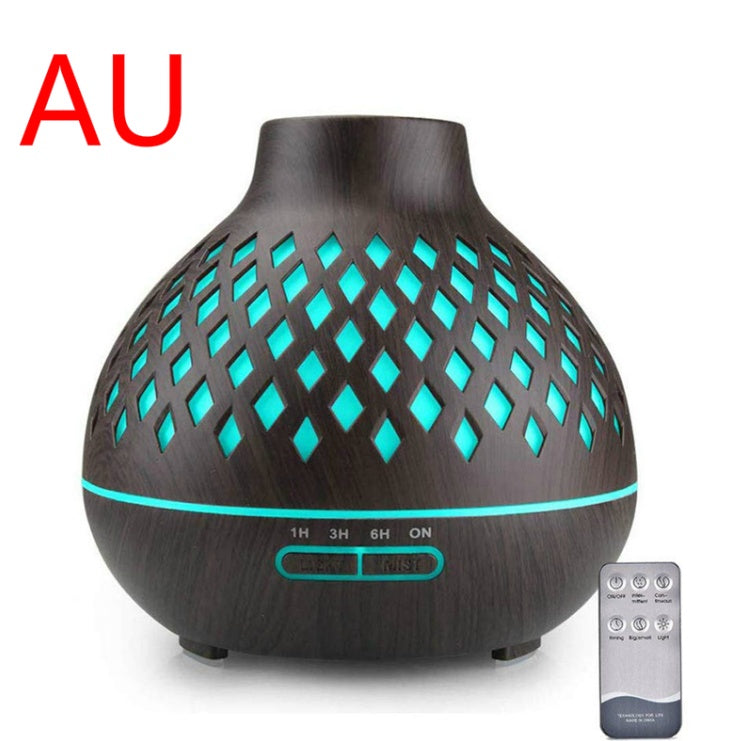 Aromatherapy diffuser with wooden texture and teal lights, accompanied by a remote control on a white background.