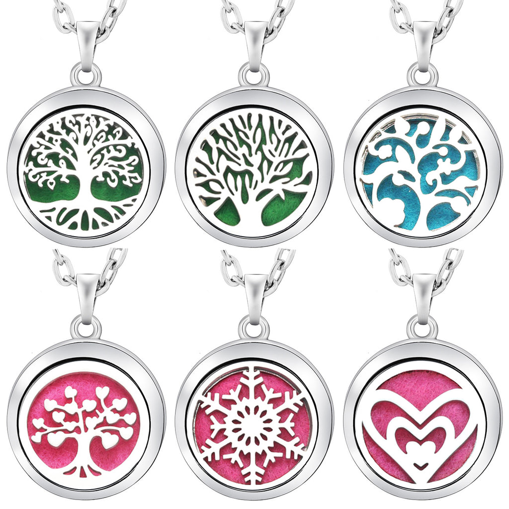 Set of five silver necklaces with circular pendant designs on a white background