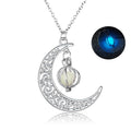 Silver crescent moon necklace with a glowing pendant on a white background