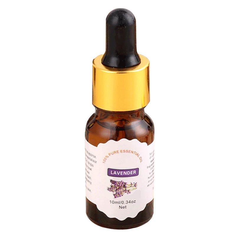 Bottle of lavender essential oil with dropper on a white background
