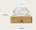 Glass dome on a wooden base with measurements indicated