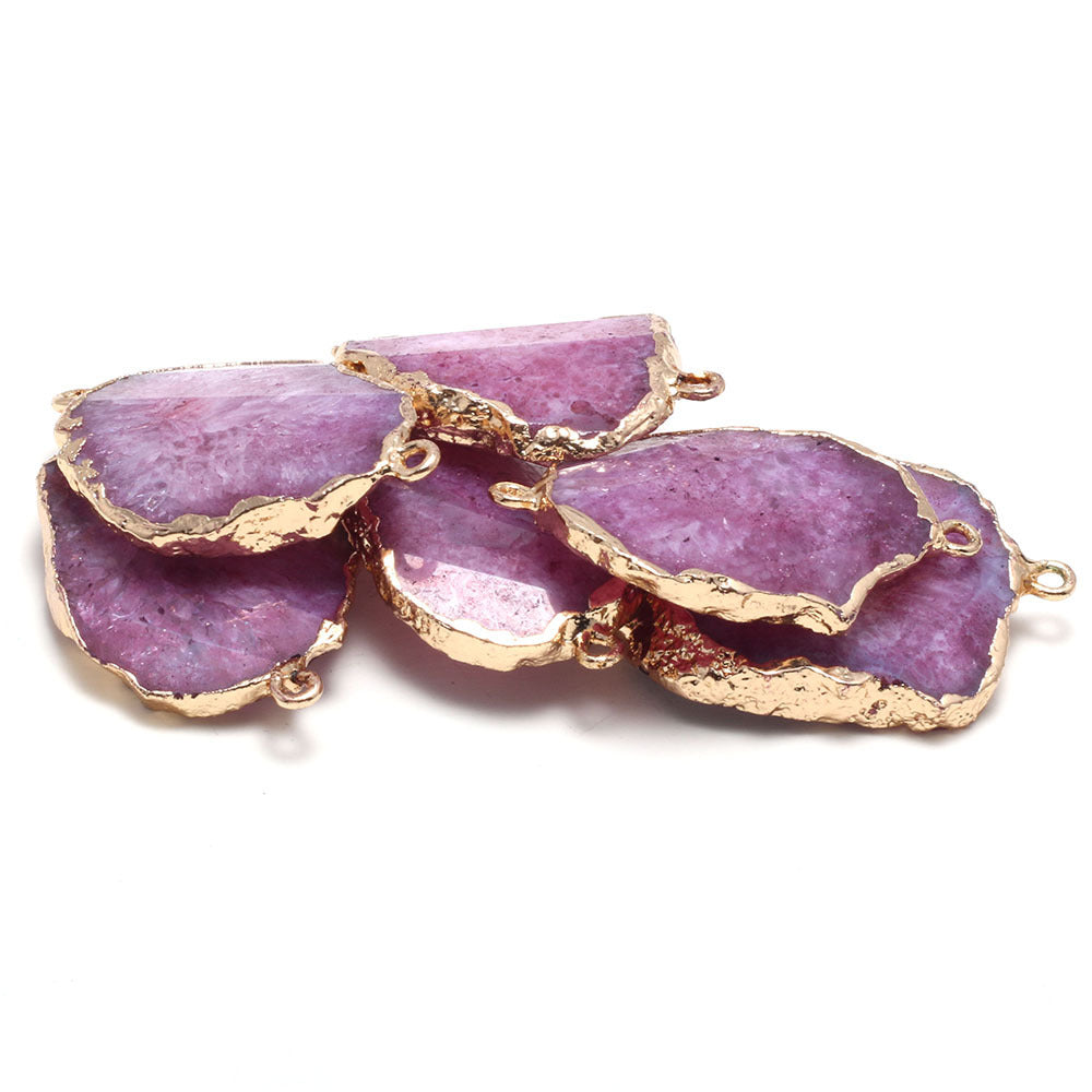 Purple stone pendants with gold accents on a white background