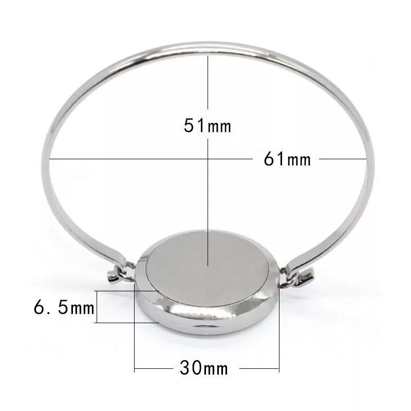 Silver bracelet with measurements on a white background