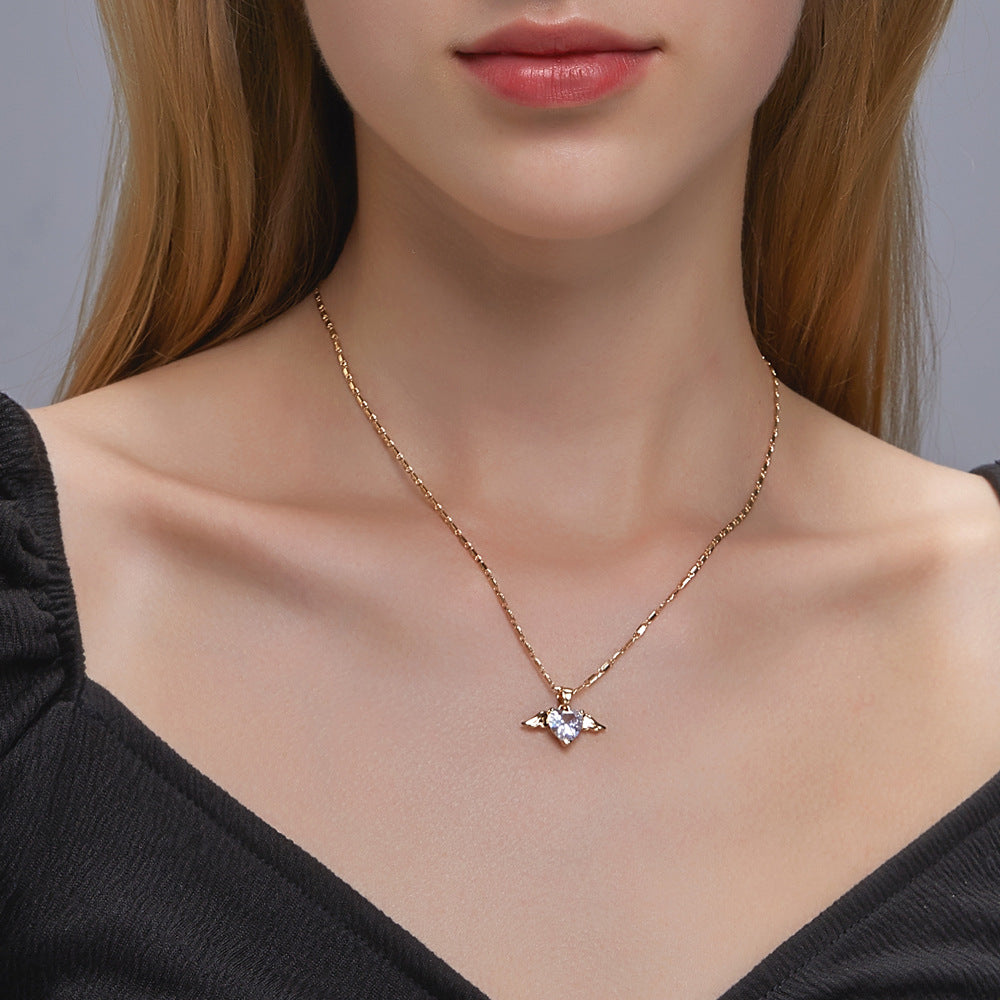 Necklace with a butterfly pendant worn by a model against a neutral background