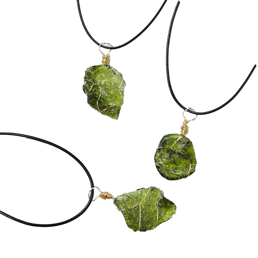 Three green stone necklaces on black cords against a white background