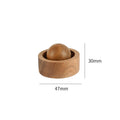 Wooden ball and cup with measurements on a white background