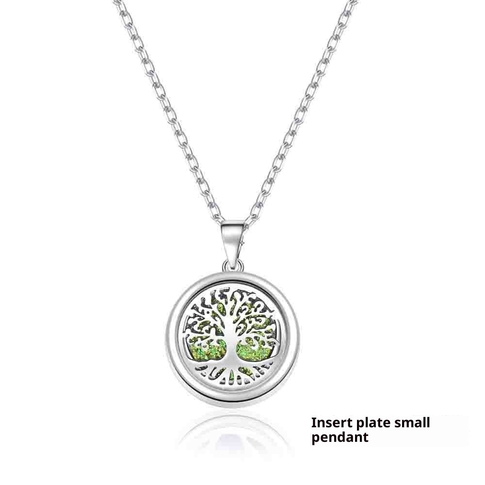 Silver necklace with a tree of life pendant on a white background