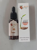 Bottle and box of Manely Magic ginger stimulating oil on a white background
