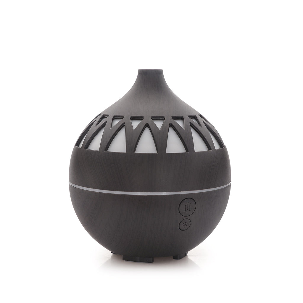 Black essential oil diffuser with geometric design on a white background