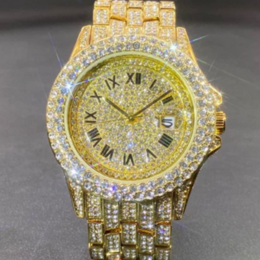 Gold watch with diamond-studded face on a gray background