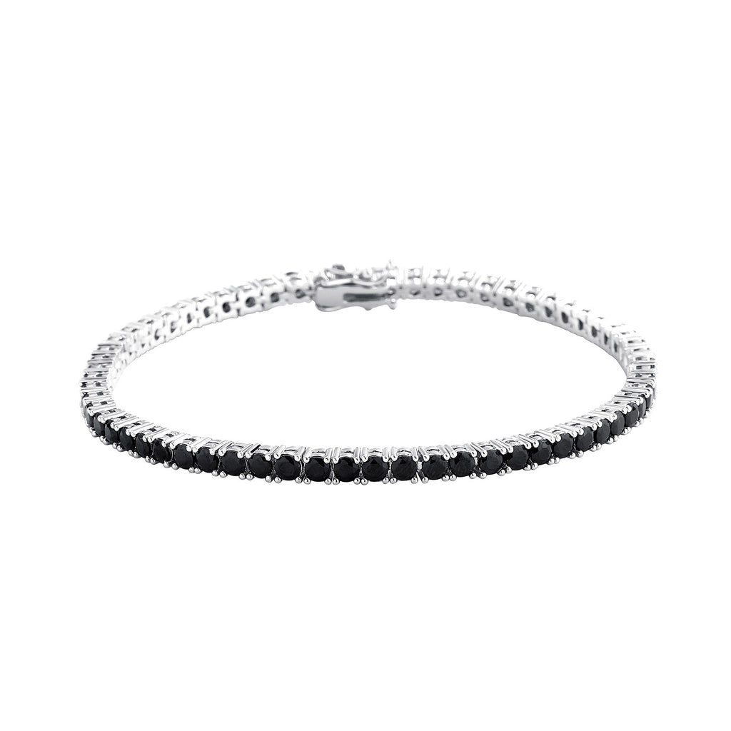 Silver bracelet with black stones on a white background