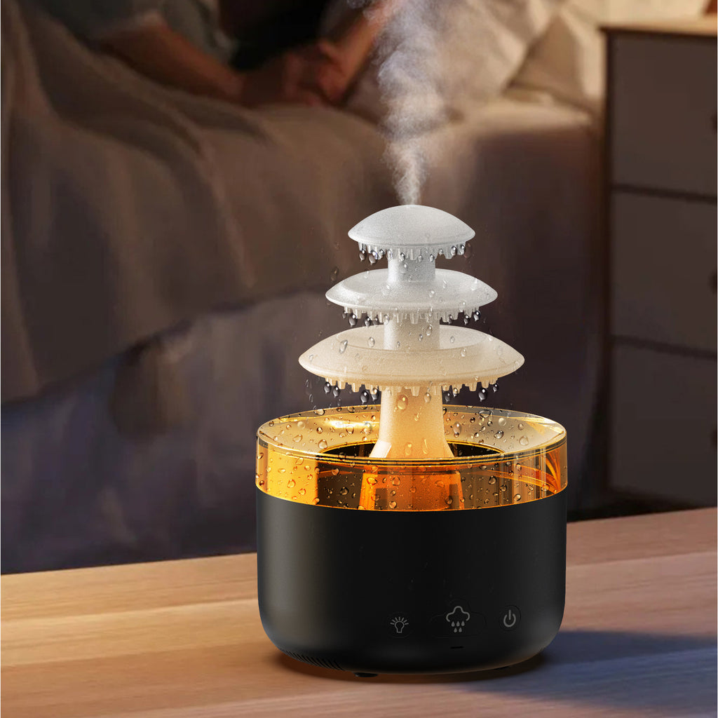 Humidifier on a table with a blurred background of a person sitting on a couch.