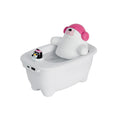 White toy toilet with a plush bear inside on a white background