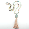 Necklace with beads and tassel on a white background