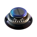 Round device with solar panel on top on a white background
