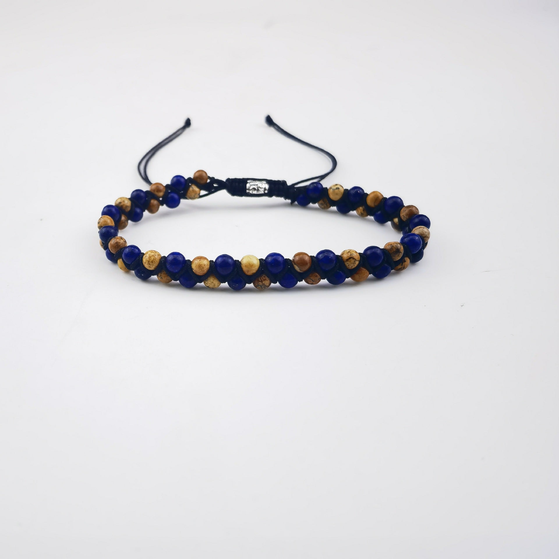 Bracelet with blue and brown beads on a white background