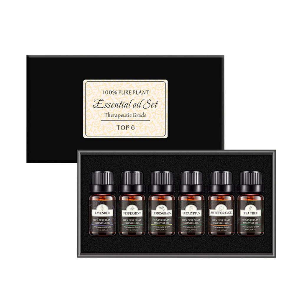 Set of six essential oil bottles in a black box with a label on a white background
