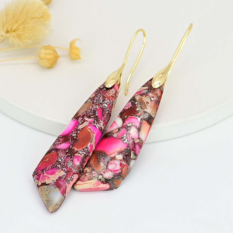Colorful marbled earrings with gold hooks on a white background