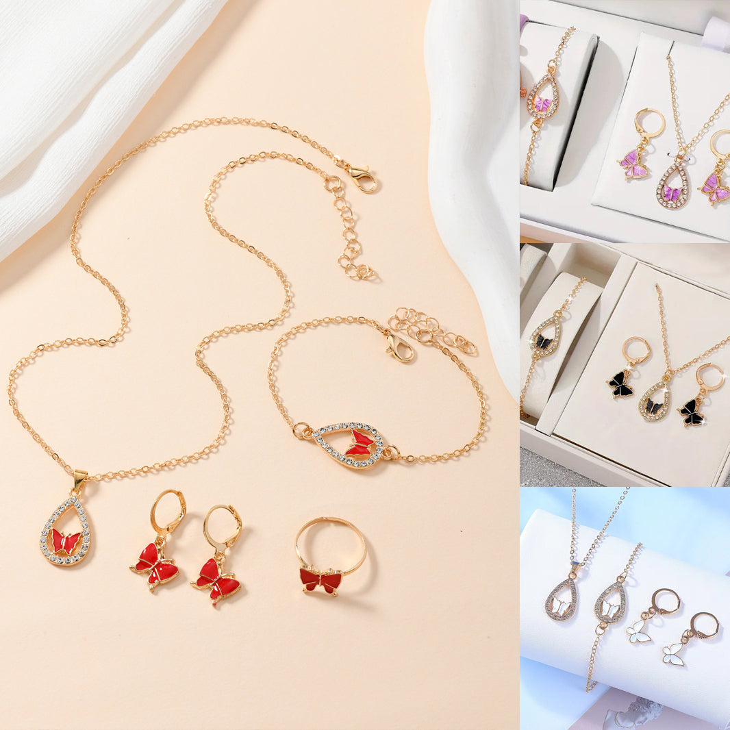 Gold jewelry set with necklaces, bracelets, earrings, and rings on a beige background.