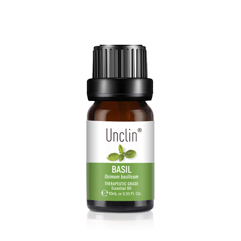 Bottle of Unclin basil essential oil on a white background