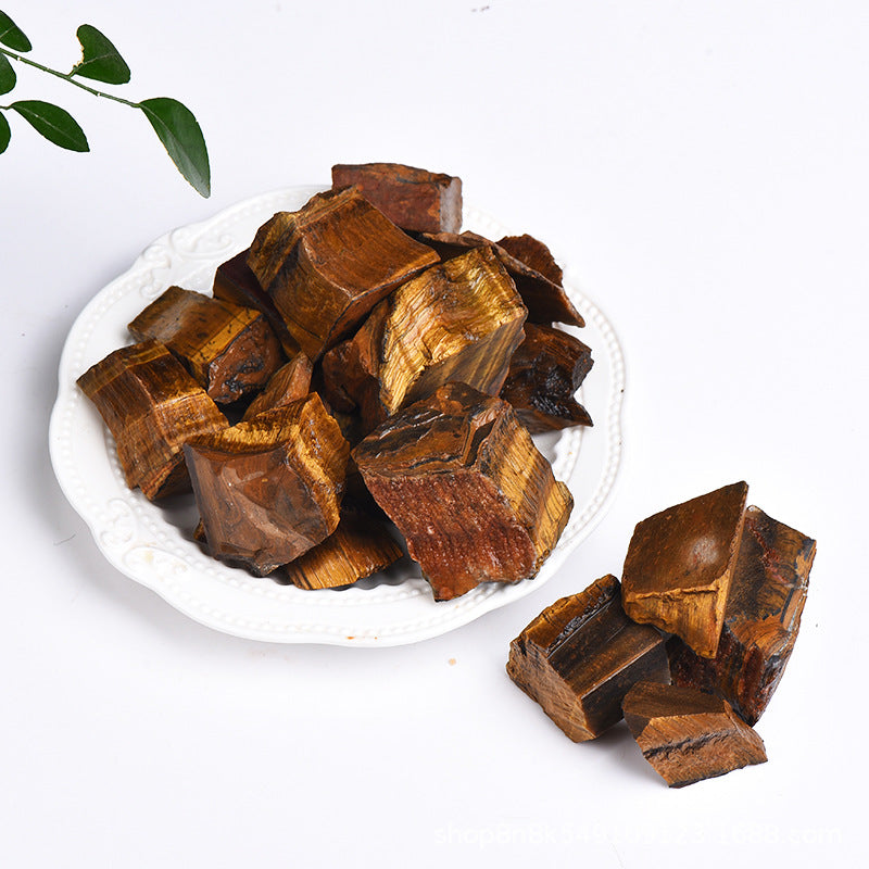 Brown wooden blocks on a white plate with a white background