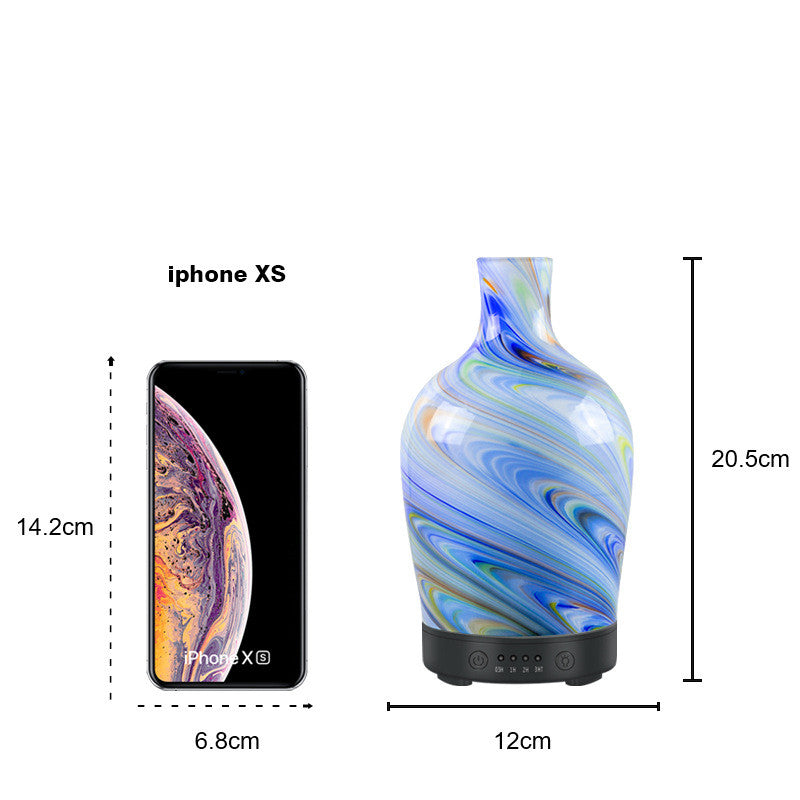 Blue marbled vase with dimensions shown relative to an iPhone XS