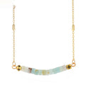 Necklace with gold chain and multicolored beads on a white background