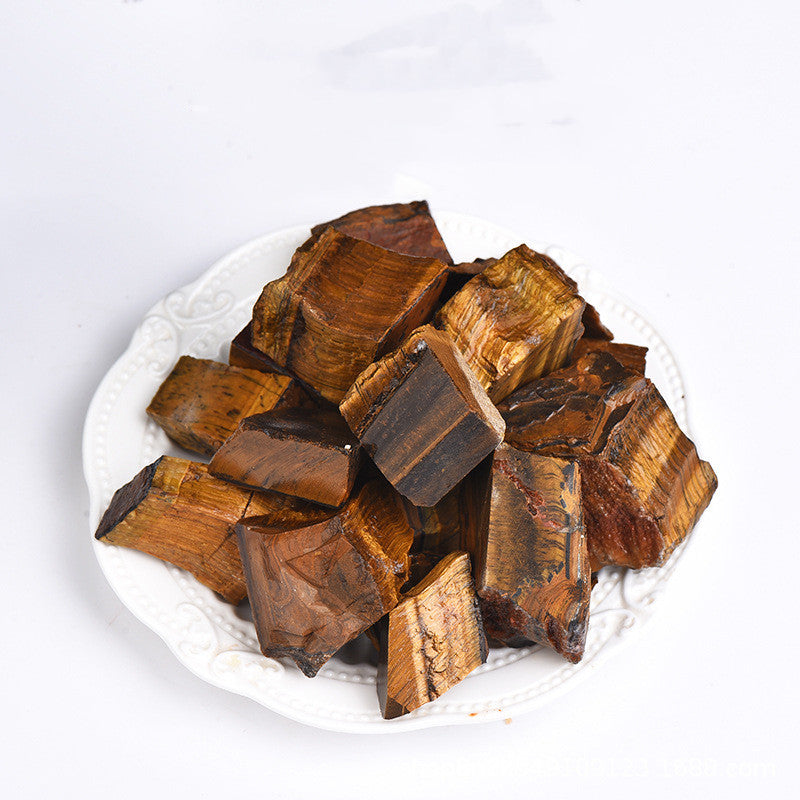 Brown wooden blocks on a white plate with a white background