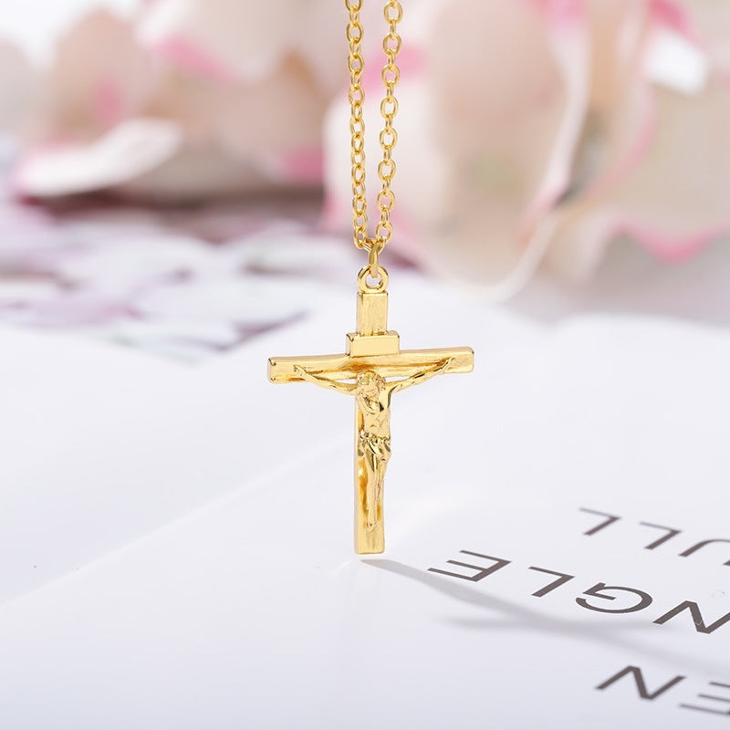 Gold crucifix necklace on a blurred background with text