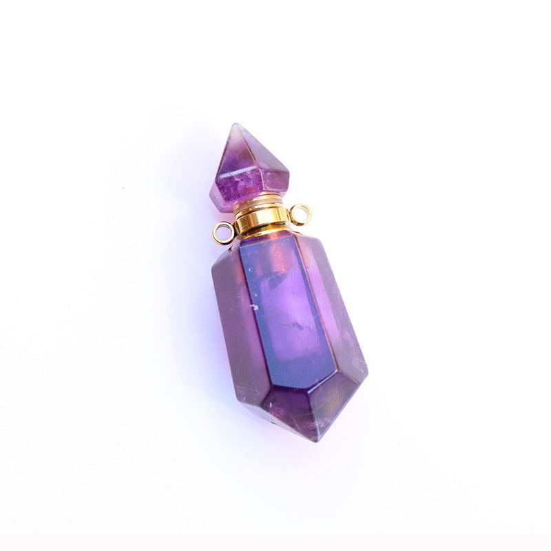 Purple crystal-shaped bottle with gold cap on a white background