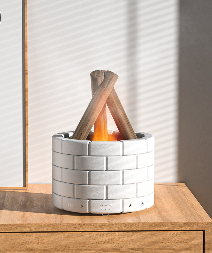 White brick-patterned fire pit with wooden logs on a wooden surface