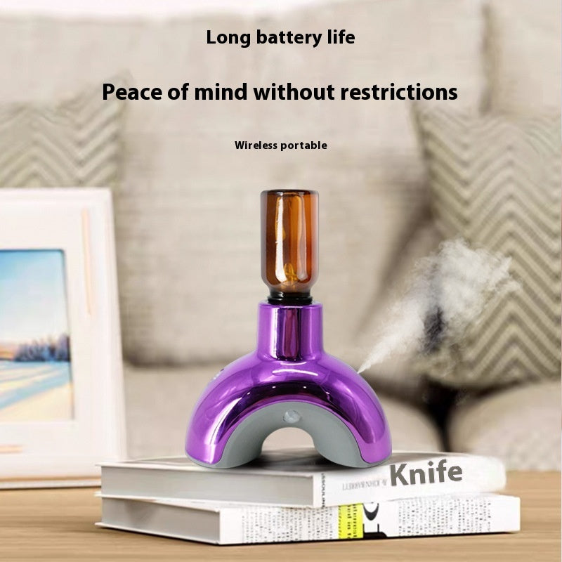 Purple electronic device with a brown top on a stack of books, with text about battery life and portability.