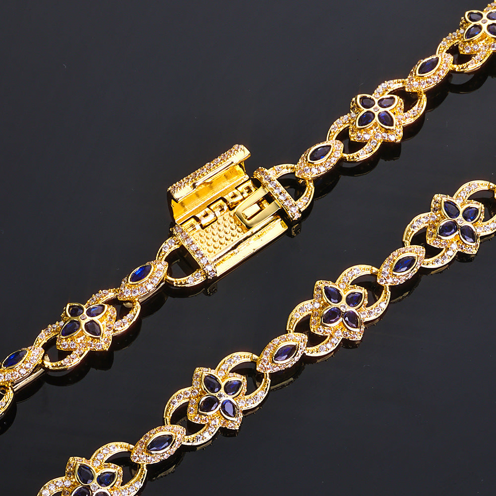 Gold bracelet with blue stones on a black background