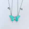 Turquoise butterfly pendant necklace on a light gray background