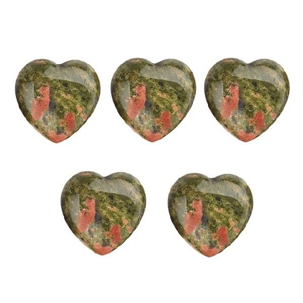 Five heart-shaped green stones with red and black patterns on a white background