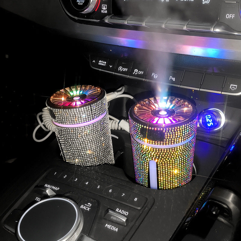 Two colorful bling car cup holders on a car dashboard.