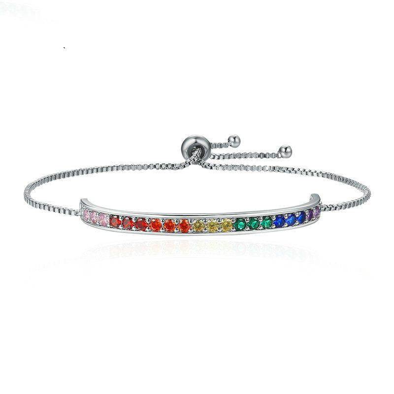Silver bracelet with colorful beads on a white background