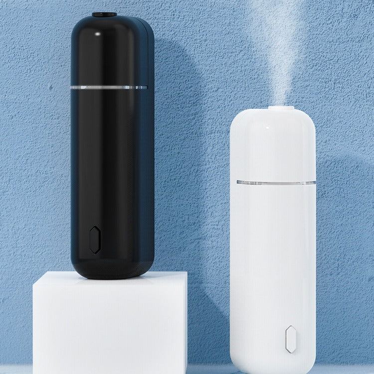 Black and white humidifiers on a blue background