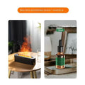 Black flame aromatherapy machine and essential oil bottle on a white background