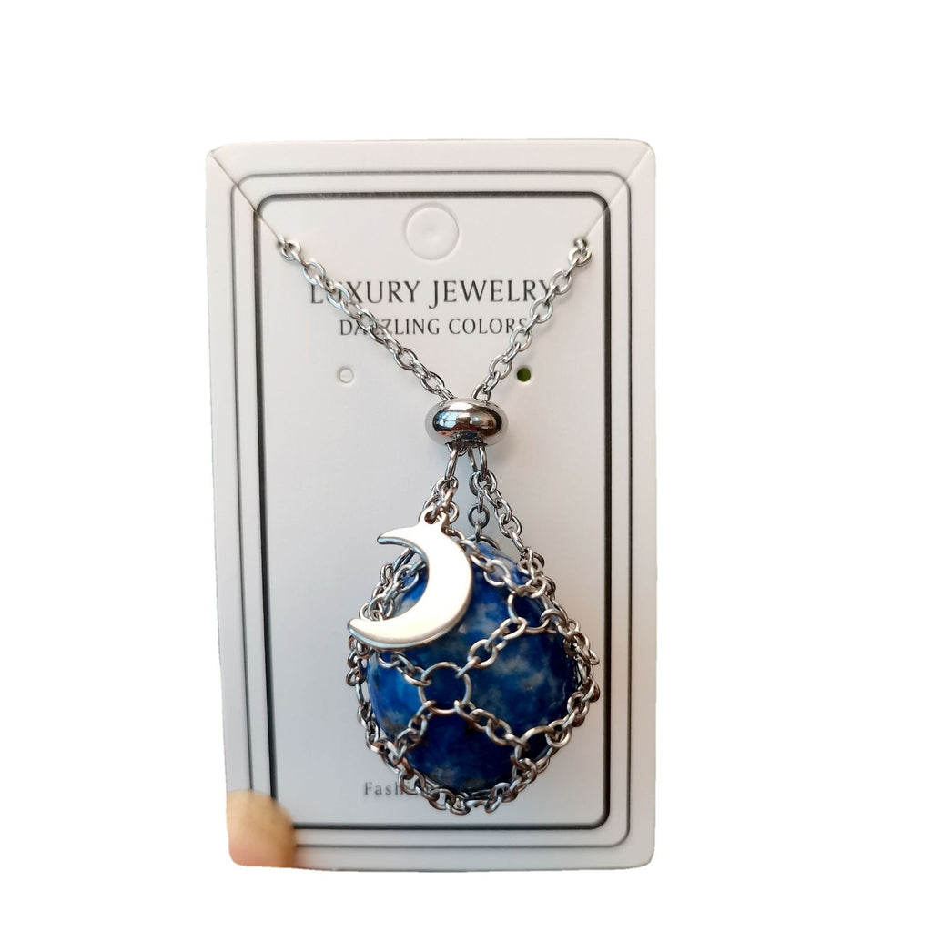 Necklace with blue pendant and silver chain on a white card