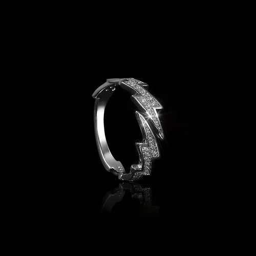 Silver ring with diamond accents on a black background