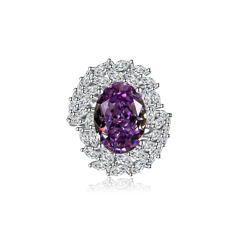Purple gemstone ring with diamond halo on a white background
