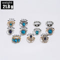 Set of rings with gemstones and measurements on a white background