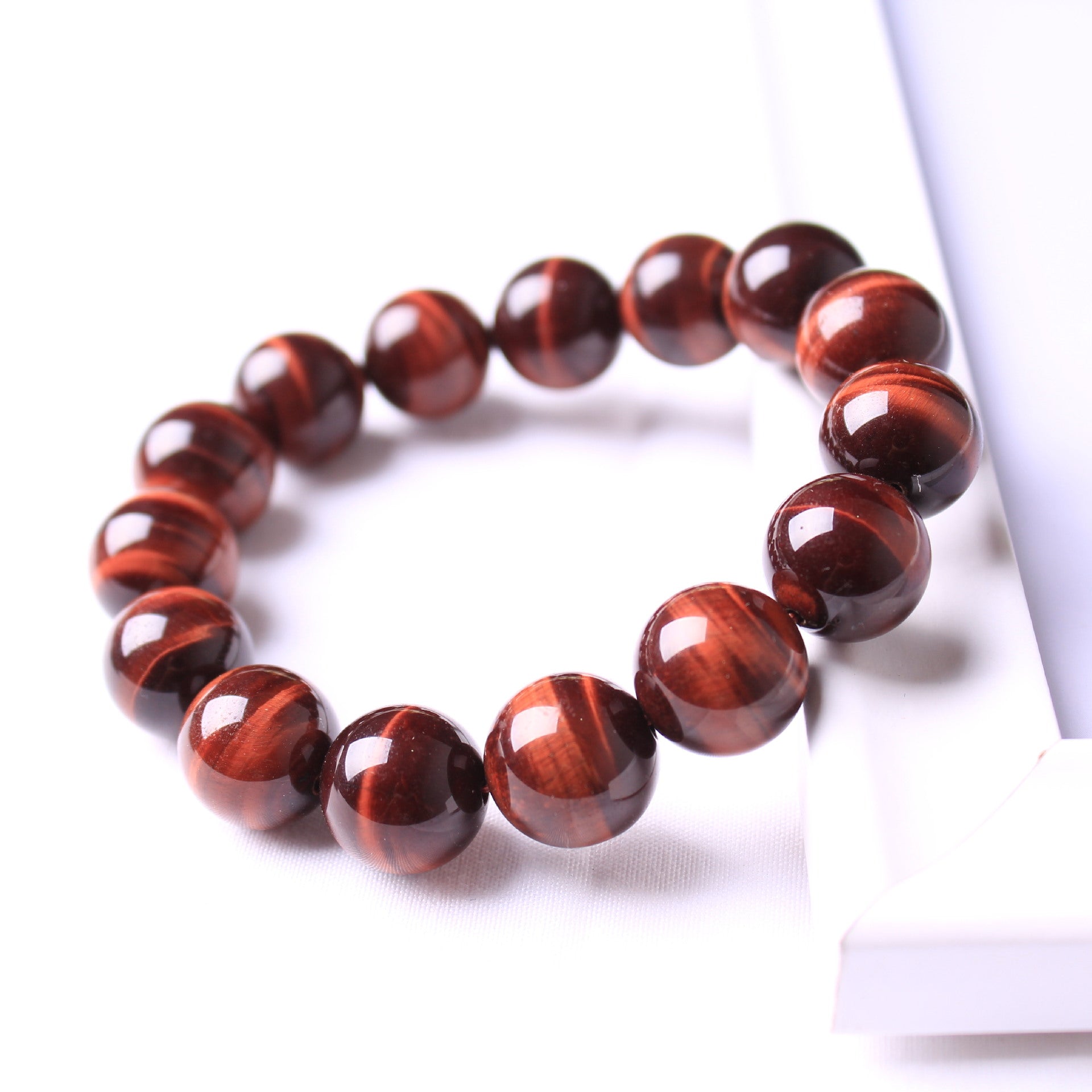 Brown beaded bracelet on a white background