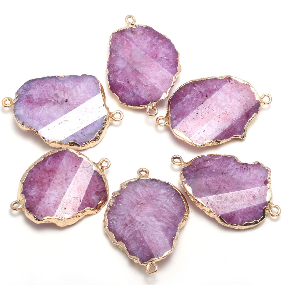 Purple stone pendants with gold accents on a white background