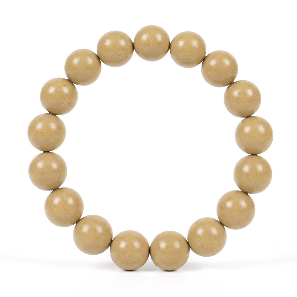 Beige wooden beaded bracelet on a white background