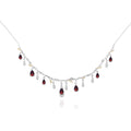 Necklace with red gemstones and clear stones on a white background