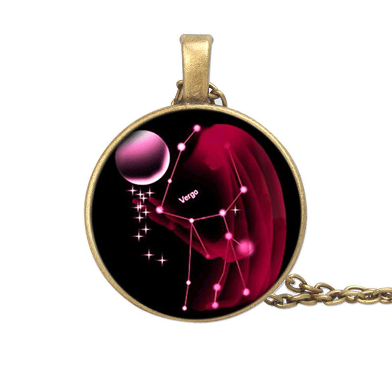 Pendant with astrological design on a black background