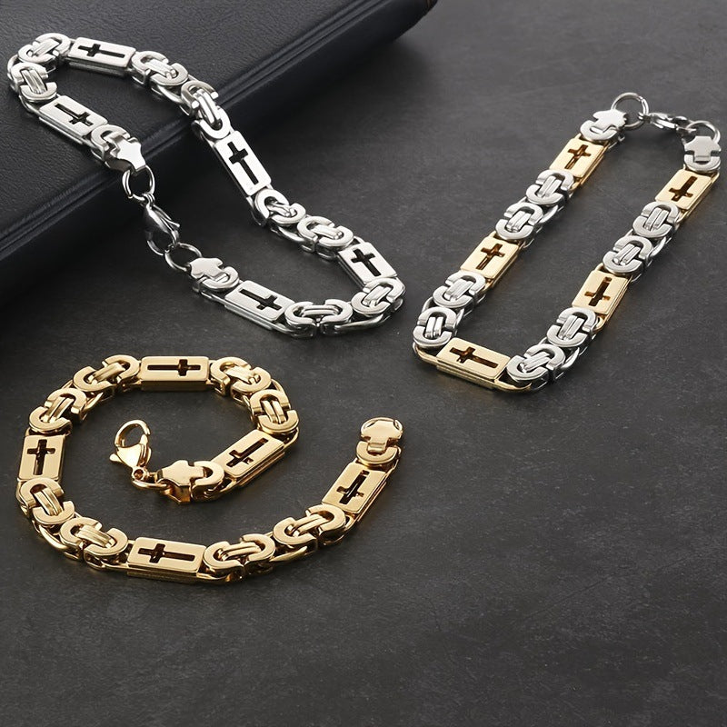 Three gold and silver chain necklaces on a dark surface