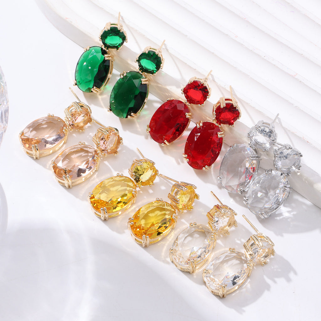 Set of colorful gemstone earrings on a white background